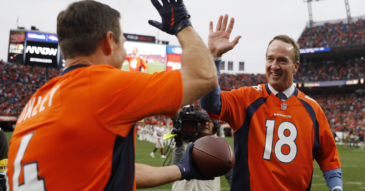 Broncos legend Peyton Manning celebrates Nuggets championship courtside