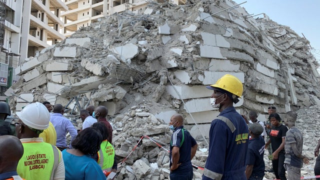 Emergency personnel stands by the debris of the collapsed building in Ikoyi 
