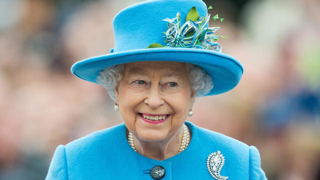 Queen Elizabeth II tours Queen Mother Square on October 27, 2016, in Poundbury, England. 