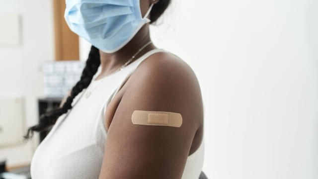 Woman getting vaccinated against COVID-19 