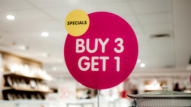 A "buy 3, get 1" sign on a shopping mall 