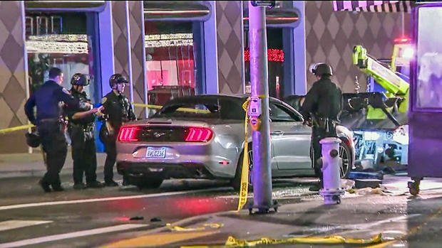 SFPD officers investigate a suspect vehicle following a smash-and-grab robbery at Louis Vuitton store 