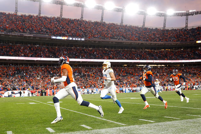 Interceptions lead to Chargers' 28-13 loss to Broncos