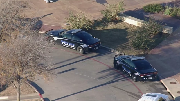 Little Elm Police in front of Little Elm High School 