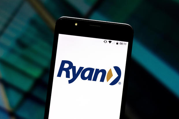 In this photo illustration a Ryan LLC logo seen displayed on 