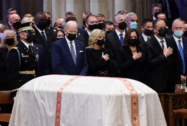 President Biden looks on as first lady Jill Biden, Vice President Kamala Harris and second gentleman Douglas Emhoff gesture during a funeral service for late Senate Majority Leader Bob Dole at the National Cathedral in Washington on December 10, 2021. 