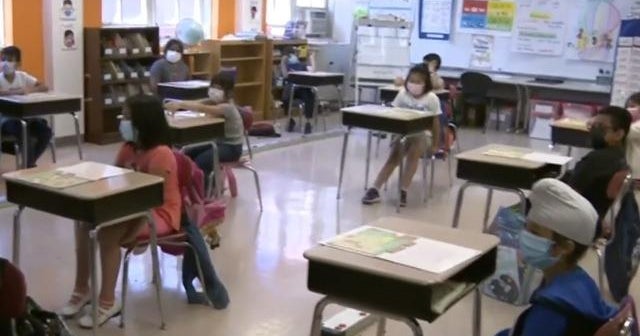 Millions return to school despite COVID surge - CBS News