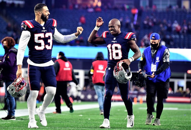 Matthew Slater walks off the field with Kyle Van Noy after the Patriots beat the Jaguars.