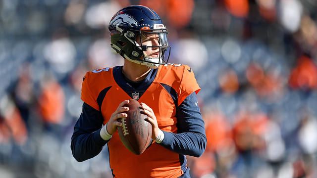 Denver Broncos long snapper Jacob Bobenmoyer walks off the field