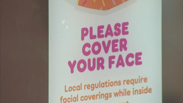 dunkin face cover sign 