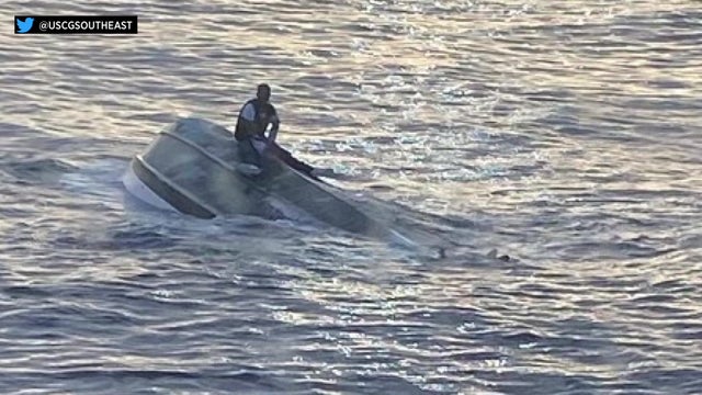man-on-a-capsized-vessel-USCG-pic.jpg 