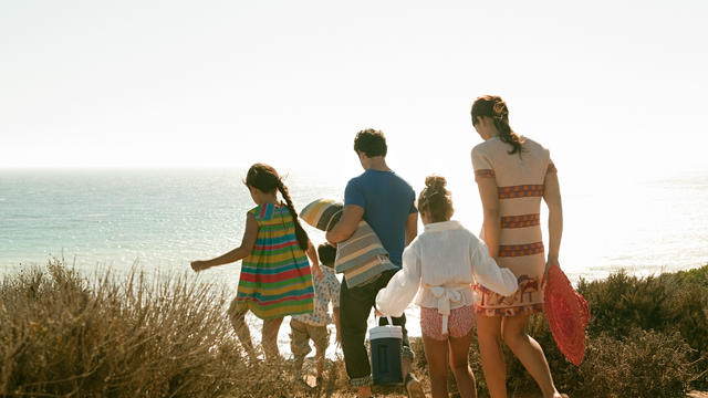 Family walking to beach 