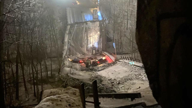 Vehicles are seen in a pileup after a bridge collapsed in Pittsburgh on January 28, 2022. 