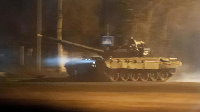 A tank drives along a street in Donetsk 