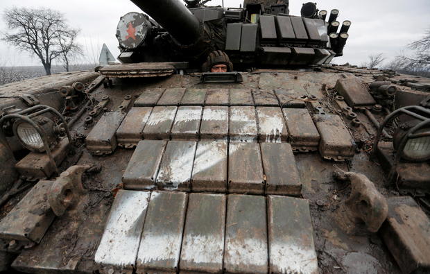 A serviceman of pro-Russian militia is seen inside a tank in the Luhansk region 