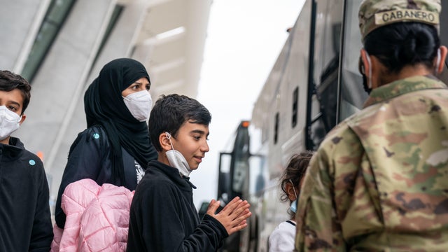 Afghanistan Refugees Arrive at Dulles International Airport 