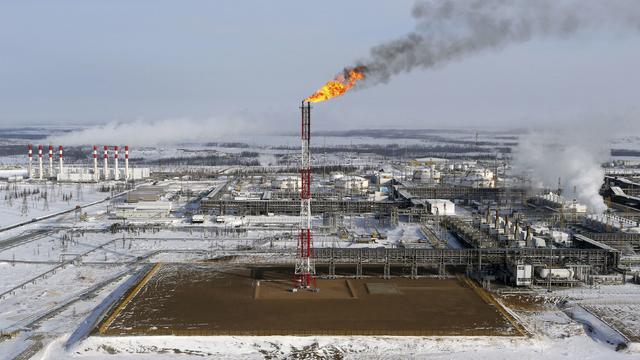 FILE PHOTO: A flame burns from a tower at Vankorskoye oil field owned by Rosneft company north of the Russian Siberian city of Krasnoyarsk 