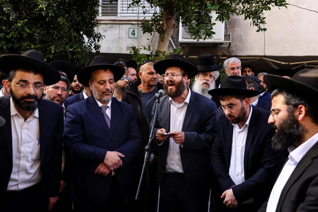 Friends and family mourn at the funeral of Avishai Yehezkel who was killed during an attack in the Israeli city of Bnei Brak, near Tel Aviv 