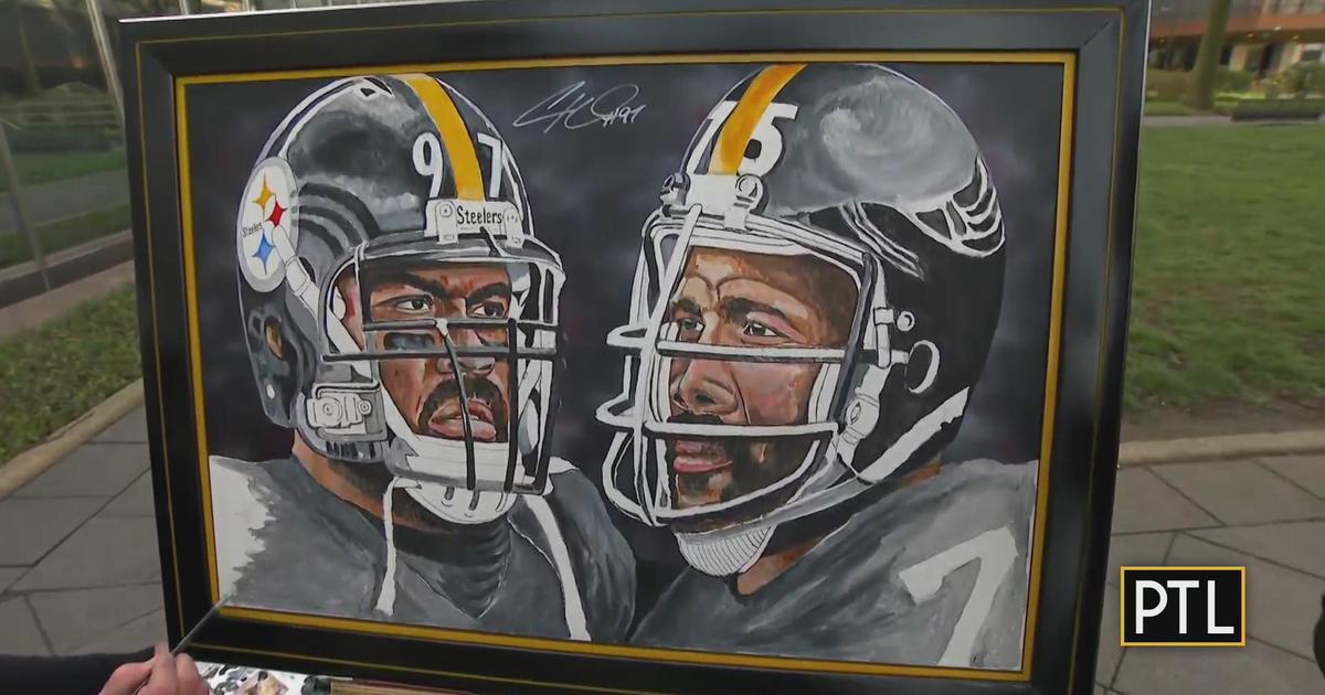 Cam Heyward gives the painting his autograph - CBS Pittsburgh