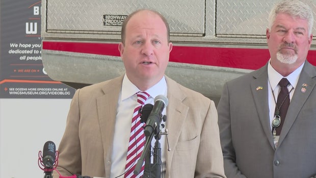 jared polis with stan hilkey (CBS)