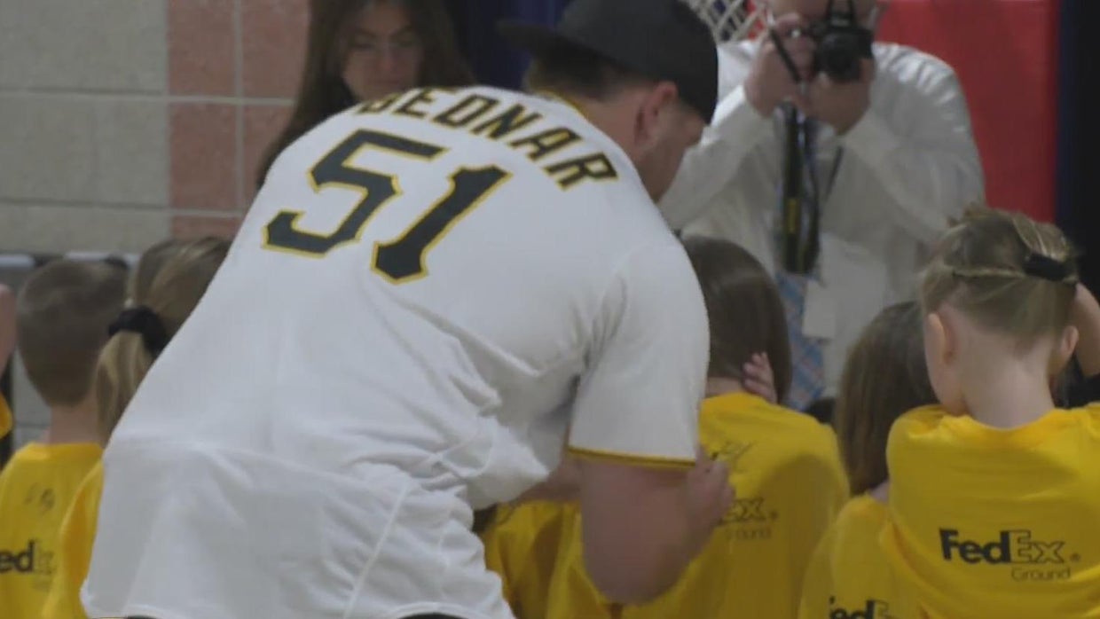 Pirates pitcher David Bednar delivers baseball gear to old elementary ...