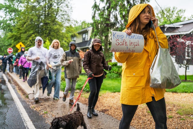 CHEVY CHASE, MD- MAY 07: Lacie Wooten-Holway walks with other a 