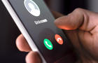 Phone call from unknown number late at night. Scam, fraud or phishing with smartphone concept. Prank caller, scammer or stranger. Man answering to incoming call. 