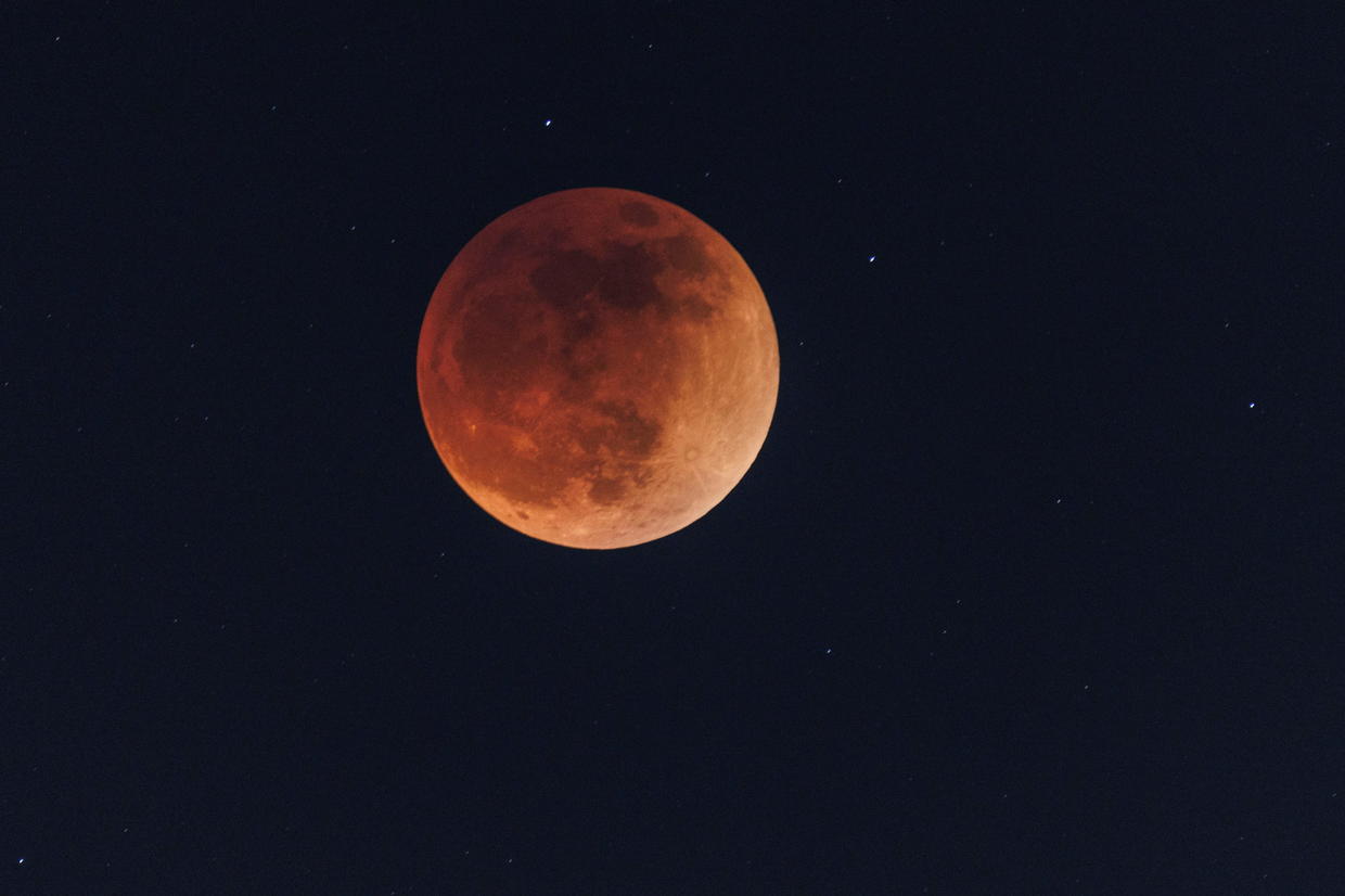 See what the rare "super flower blood moon" total lunar eclipse looked