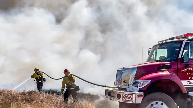 Contra Costa County firefighters battle a brushfire 