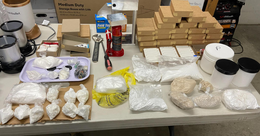 2 arrested after police seize drugs, guns and cash in Ambridge raid