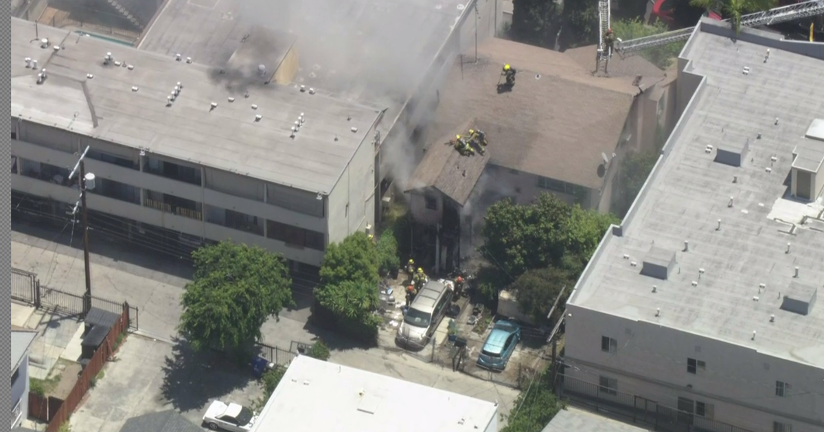 Crews battle blaze tearing through house in Westlake district - CBS Los ...