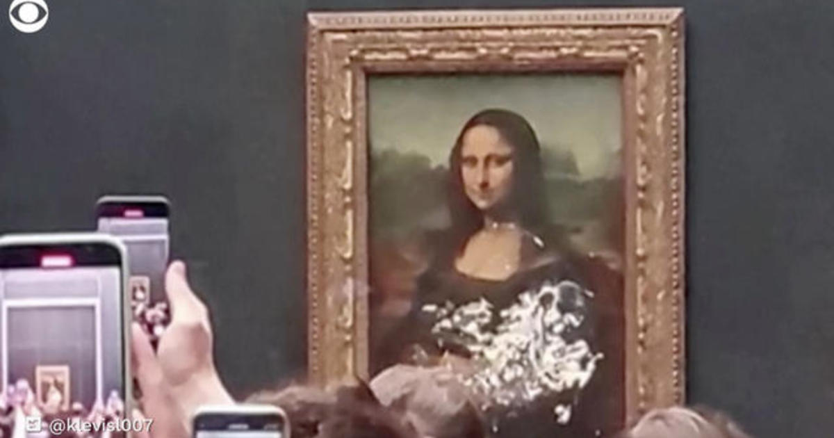 Mona Lisa Caked by Man Disguised as Old Lady in Wheelchair - PAPER Magazine