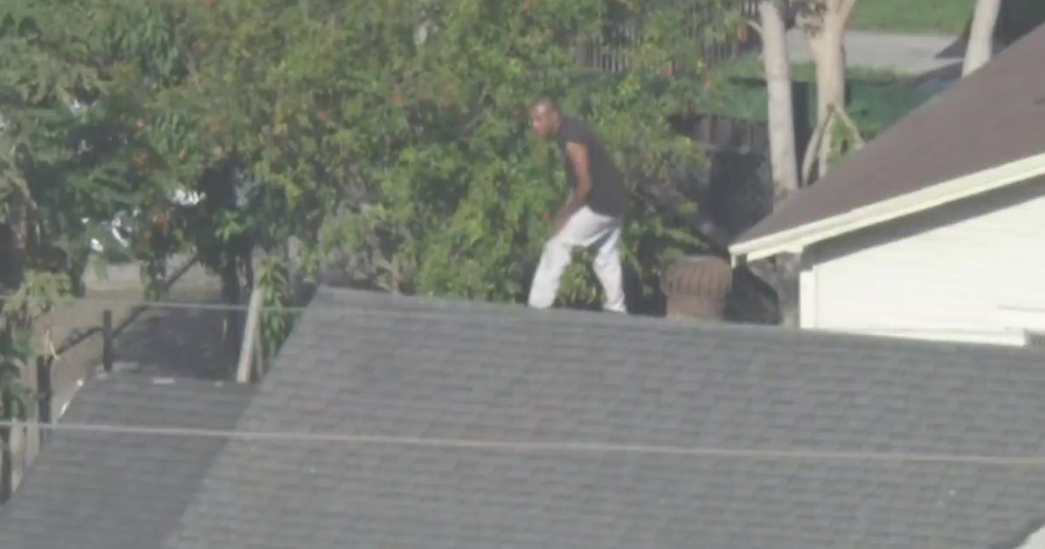 Officers engaged in standoff with suspect on roof in South Los Angeles ...