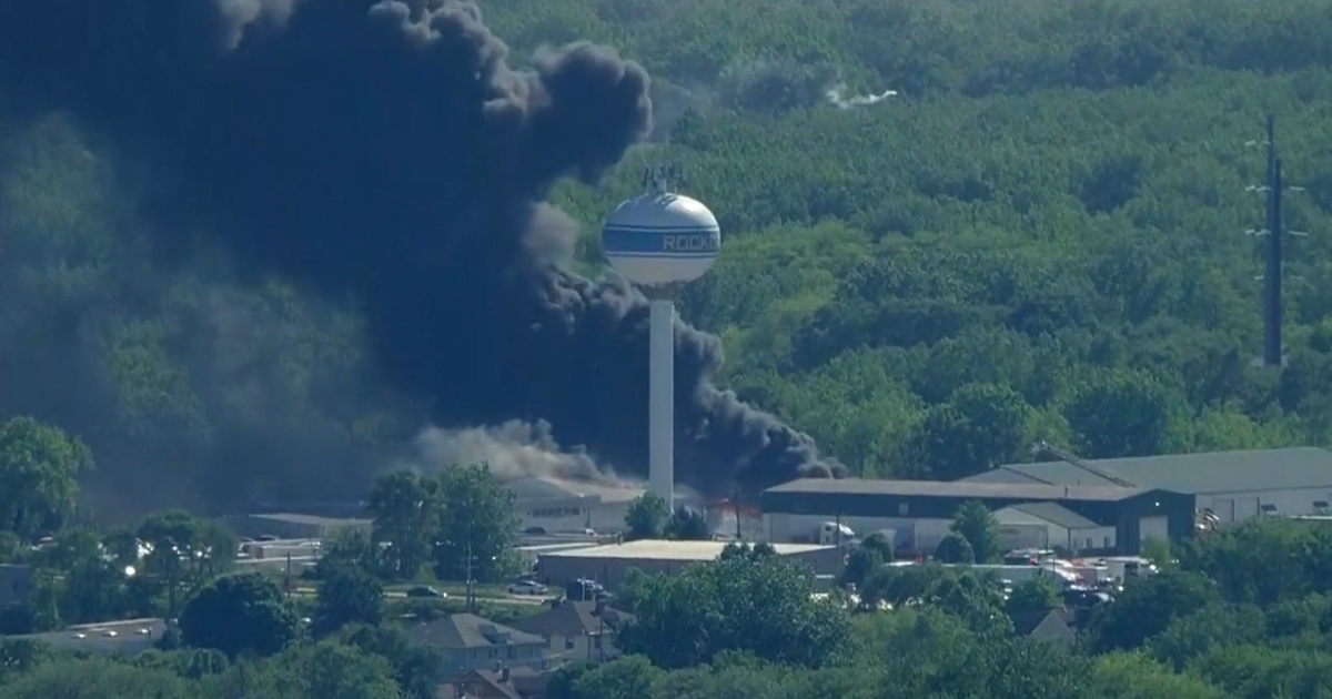 Massive fire rips through truck maintenance center, parked truck