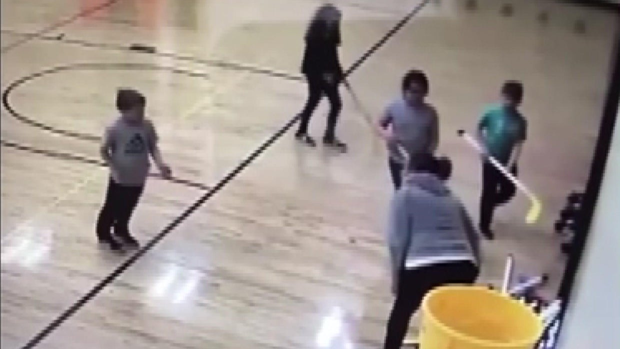 Video shows Minnesota teacher throwing hockey stick at 8yearold