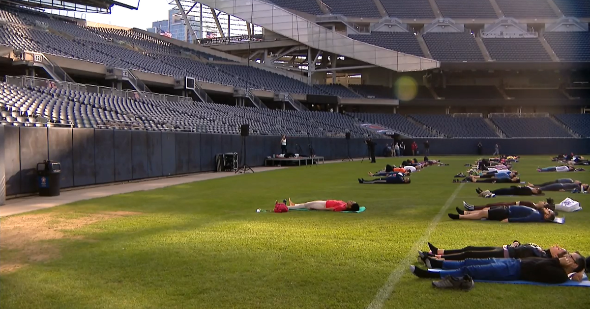 Soldier Field transformed from gridiron to outdoor yoga studio for