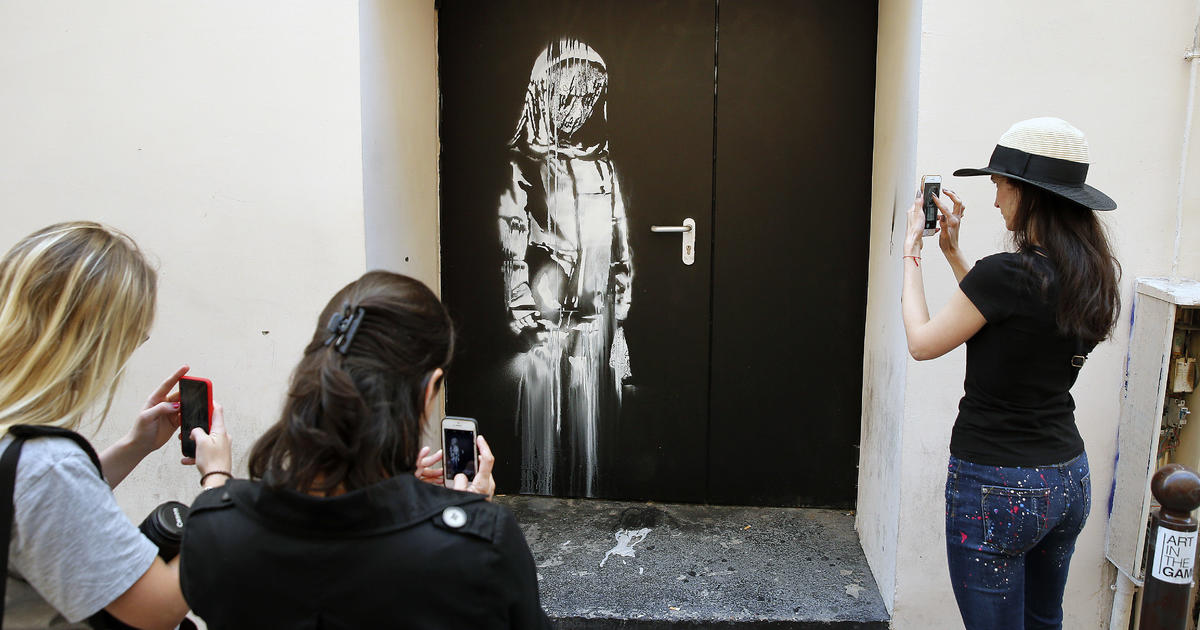 8 men on trial accused of stealing Banksy mural done on door of Paris' Bataclan to honor terror victims