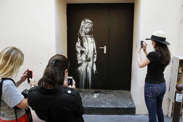 Graffiti Artist Banksy Mural In Paris 