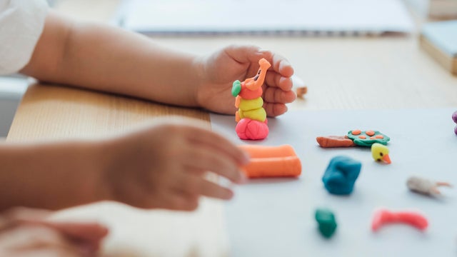 Hands of an Anonymous Girl Making Plasticine Figurines, Art and Craft Concept 