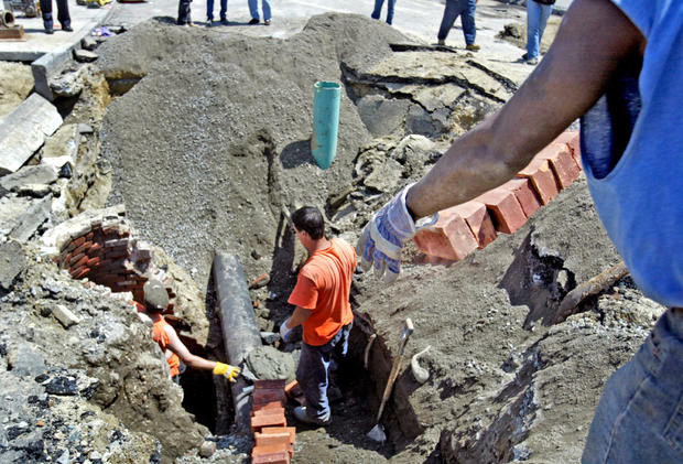 5/30/07 - Boston, MA. Bricklayers work to repair damage from a water main break on Blackstone Street in Boston Wednesday.   Saved in Photo Adv News. Staff photo by David Goldman. 