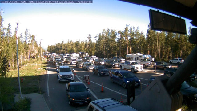 Cars are queued at the entrance to Yellowstone National Park in Montana