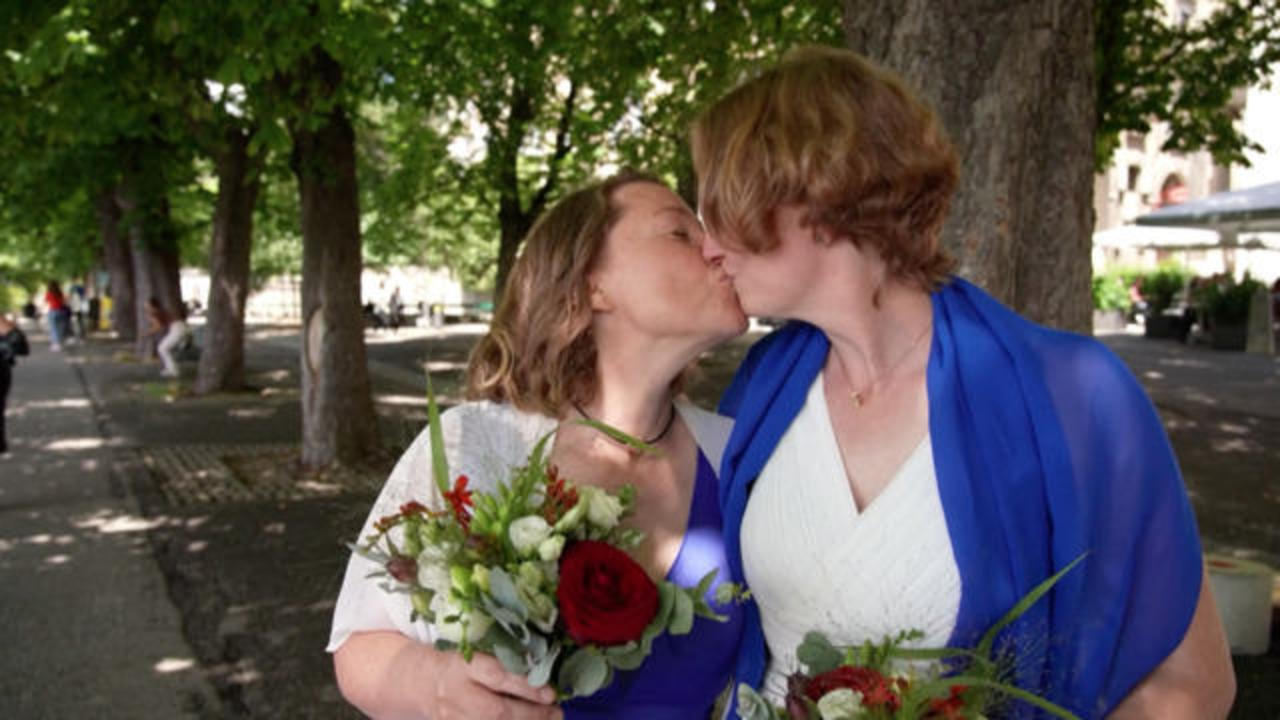 Sax Boy Girl Video - First Swiss same-sex couples tie the knot - CBS News