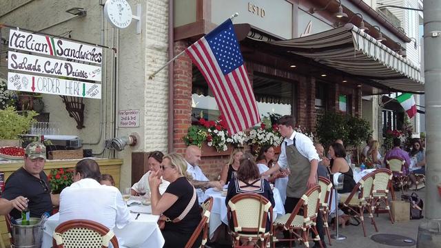 Patrons sit at tables outside Angelica's Restaurant in Sea Bright, New Jersey 