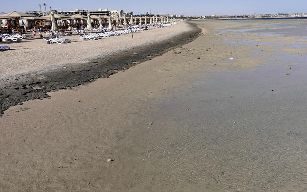FILE PHOTO: Empty sunbeds are seen during a low tide at the beach of the Red Sea resort of Sahl Hasheesh, Hurghada 