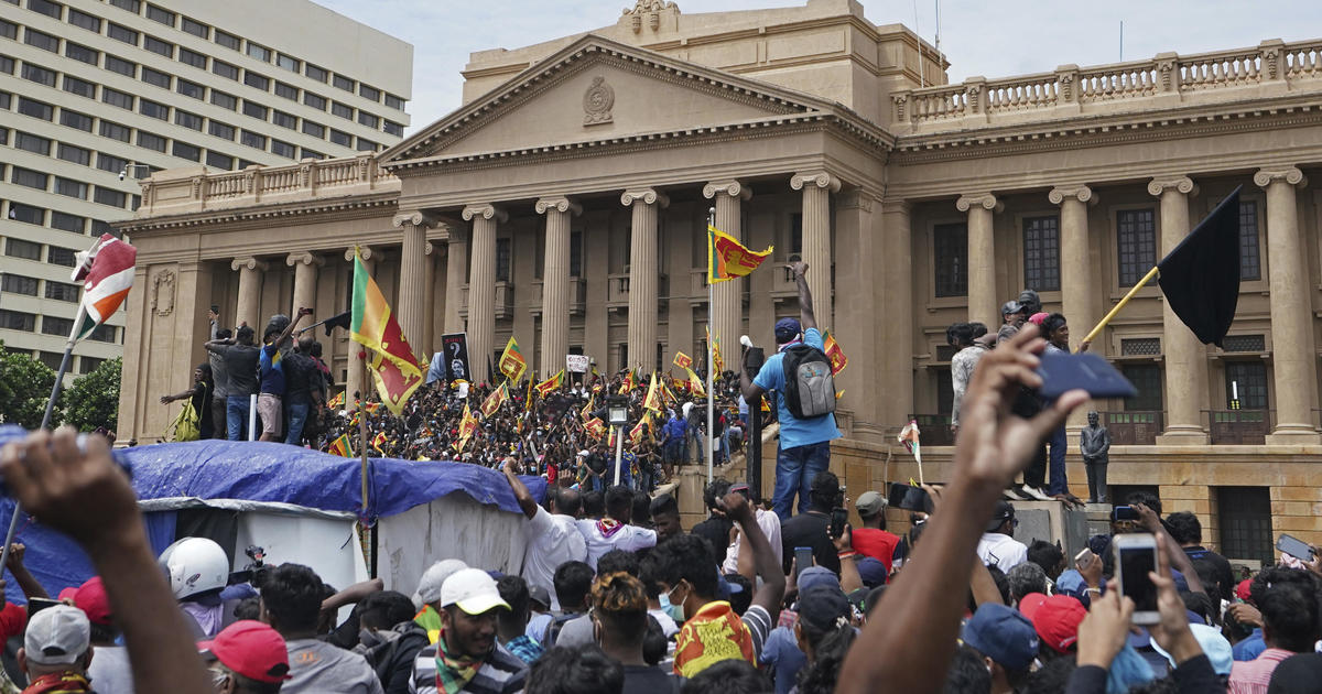Sri Lankans storm president's house, office in biggest rally