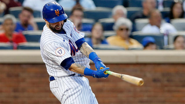Tomas Nido #3 of the New York Mets connects on a game tying tenth inning RBI double against the Miami Marlins at Citi Field on July 09, 2022 in New York City. 