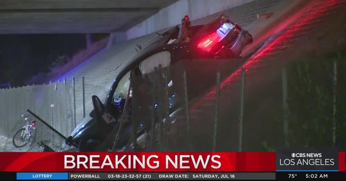 Car drives off 105 Freeway embankment, killing one and critically