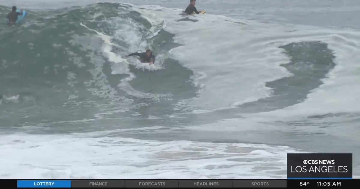 Onlookers gather at The Wedge in Newport Beach as highpowered swells