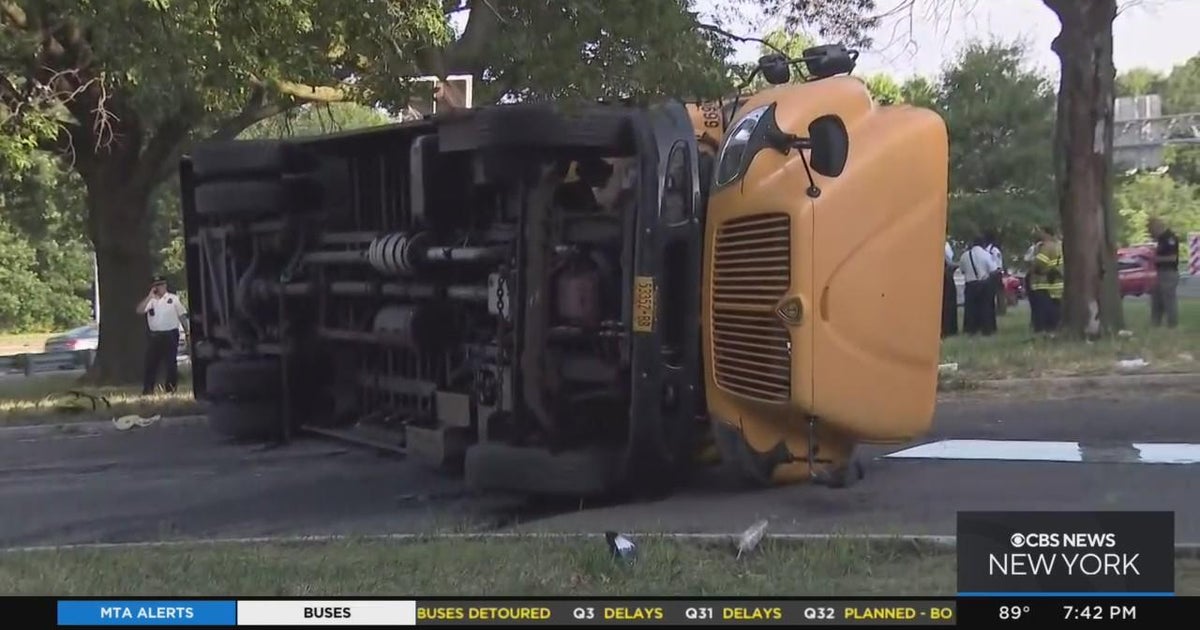 School bus overturns in the Bronx, no children on board - CBS New York