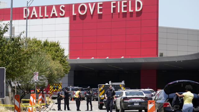 Emergency responders converge near the main entrance at Dallas Love Field airport in Dallas, July 25, 2022. 